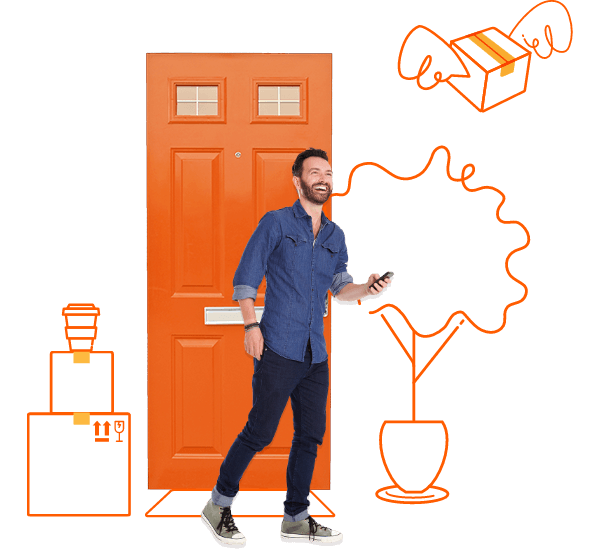 Man holding phone in front of orange door with moving boxes